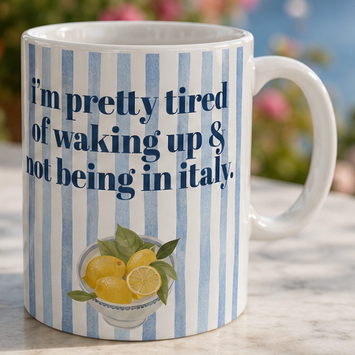 A funnt mug with blue vertical stripes, featuring the text 'i'm pretty tired of waking up & not being in italy" Italian Summer Vacation FOMO